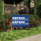 "Defend Democracy. Defend our future" yard sign.